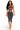 A woman modeling a dark gray distressed two-piece activewear set consisting of a strappy crop top and matching high-waisted capri leggings, shown against a plain white background.