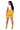 Woman wearing mustard yellow shorts and a white top on a white background