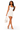 A woman modeling a fitted white halter mini dress, holding a matching white quilted handbag with gold-tone hardware, against a plain white studio background.