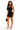 A woman modeling a black one-shoulder bodycon mini dress, holding a small black handbag and wearing clear high-heeled sandals against a plain white background.