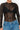 Picture of the body view of a women wearing a black lace bodysuit