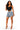 A woman modeling a black scoop-neck crop top and distressed light-wash denim shorts with frayed hems, paired with clear high-heel sandals, against a plain white background.
